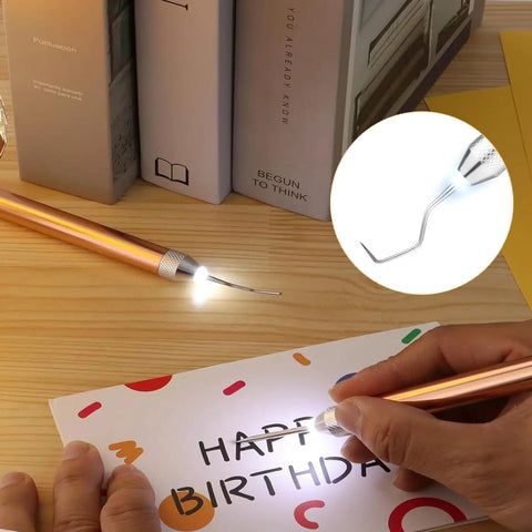 Person using a lighted vinyl weeding tool from the Lighted Vinyl Weeding Tools Set 3 Piece Pin And Hook Led Pen for crafting