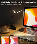 Rechargeable Clip On Reading Light With 14 LEDs, 3 Color Modes And 8 Brightness Levels, Black, illuminating a desk scene with laptop.