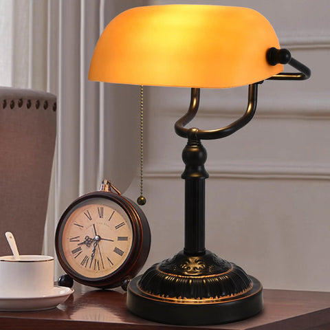 Bankers Desk Lamp With USB Port, Dope Rustic Oil Rubbed Bronze Finish, Pull Chain Desk Light With Amber Yellow Glass Shade, Vintage Home Office Library Accent Lamp For Reading And Task Lighting on a desk with a clock and cup.