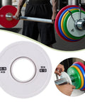 0.5 Kg Barbell Change Plate With Grooved Inner Design For Stable Lifts, White finish on barbell in gym setup