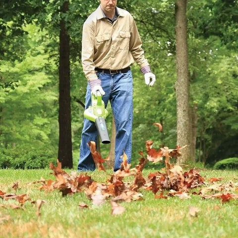 Person using 40V Cordless Brushless Leaf Blower Vacuum 185 MPH 340 CFM 2 In 1 Quick Switch With Bag for yard cleanup