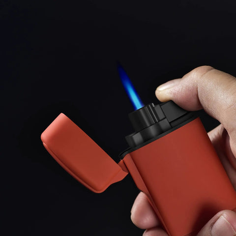 Mini Jet Torch Lighter Windproof Refillable Butane Pocket Sized Lighter igniting blue flame, close-up view