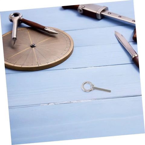 Pro Grade Stainless Steel Eye Bolt M10x60 With Nut And Flat Washer on wooden desk with compass and tools