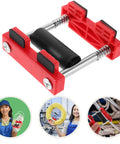 Pro Grade Wire Threading Aid Tool For Electricians With Smooth Cable Movement, Versatile For Plastic And Steel Boxes, Cable Puller And Reel Mechanism To Prevent Wear, A Real Workhorse For Electrical Projects And Sockets. red plastic and steel wire threading tool with roller and spring mechanism for cable pulling