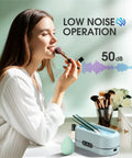 Woman near Ultrasonic Jewelry Cleaner With Digital Timer 50KHz Deep Clean In 304 Stainless Steel, showing low noise operation at 50 dB