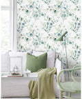 Living room with Easy Peel And Stick Boho Eucalyptus Green And White Floral Wallpaper For Walls, featuring green chair and decor.