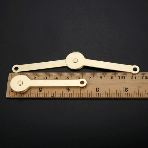 Gold Metal Lid Support Hinges Set Heavy Duty 2.68 by 0.31 Inch 2 Pack shown with scale measurement on black background