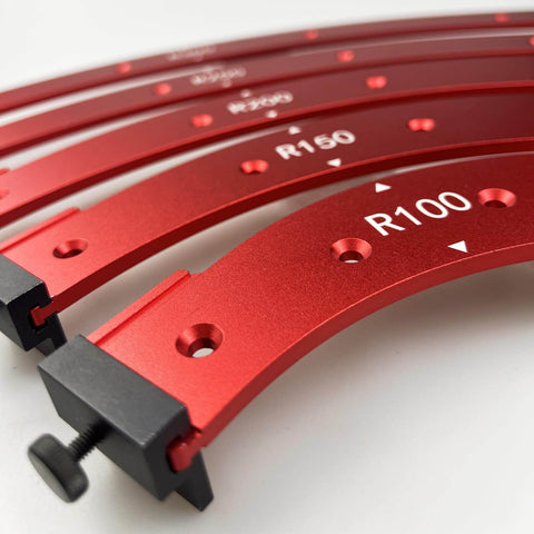 Five-Piece Router Corner Radius Template Set For Woodworking With Durable Aluminum Radius Jig And Corner Routing Guide, Includes R100 R150 R200 R250 R300 For Furniture Edges, Cabinets, And Decorative Trims, close-up of red templates with measurement markings.