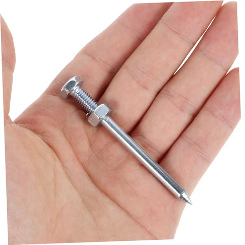 Hand holding 7 cm metal spike for Ten Piece Lawn Aerator Shoes With Metal Spikes For Deep Soil Aeration And Healthier Grass Growth.