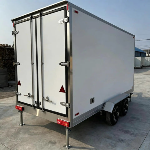 Sleek Portable Refrigerated Trailer Featuring Heavy Duty Mobile Cooling System For Catering Teams And Large Outdoor Events rear view with double doors.