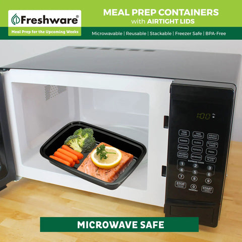 50 Pack One Compartment Meal Prep Containers With Lids, BPA Free Bento Boxes in microwave with food inside