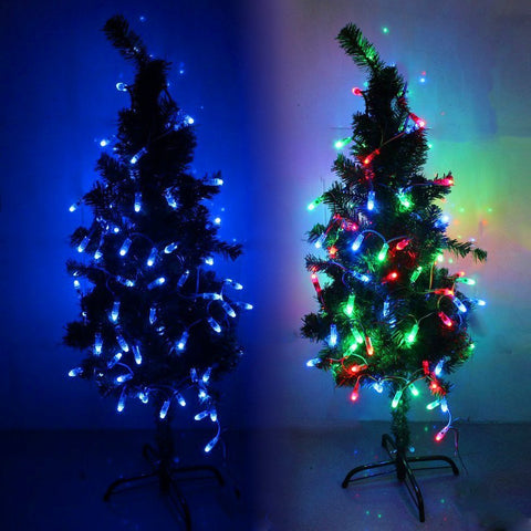 Lit 500 Pack WS2811 LED Pixel String Lights, 12mm Round, Waterproof IP68, on tree with blue and multicolor modes visible.