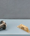 Copper Ball Catch Door Latch Set For Boats And Yachts, marine cabinet hardware with bolt and ball mechanism on grey surface