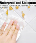 Cleaning the waterproof Top Shelf 3D Peel And Stick Ceiling Tiles 30 Pieces Soft PVC Foam Panels with a cloth.