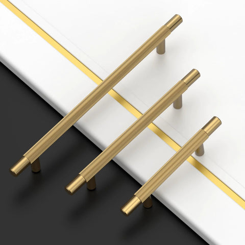 Set of three champagne bronze knurled handles on a black and white surface, includes Champagne Bronze Knurled 3 Inch (76mm) Cabinet Handles 10 Pack for Kitchen Cabinets Cupboards Drawers Durable Cabinet Hardware Pulls Ergonomic Grip Easy to Install.