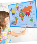 Child pointing at Colorful Laminated World Map Poster For Kid Friendly Wall Decor Educational Geography Chart For Preschool And Kindergarten Home Schooling Durable Wear Resistant With Bright Colors And Rounded Corners 60x45 Cm on wall.