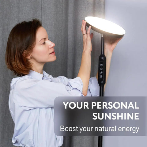 Woman adjusting Lit 24W LED Daylight Floor Lamp Free Standing Uplight Torchiere for natural daylight in room