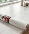 Peel And Stick Marble Countertop Cover 30x120 Inches White Marble Self Adhesive Waterproof Wallpaper on a kitchen counter