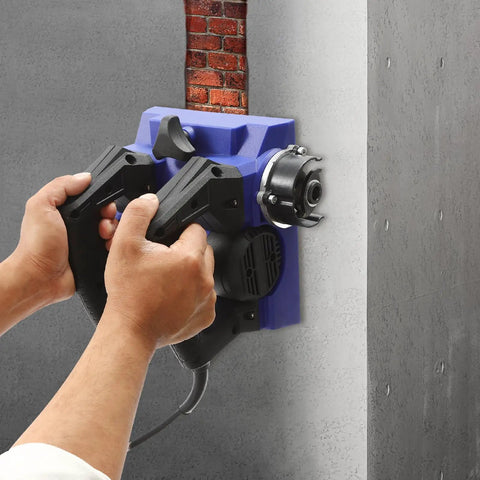 Hands operating the Heavy Workhorse 1300W Handheld Wall Planer against a concrete wall, showcasing its 6 inch wide blade.