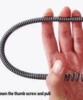 Rock Solid Drain Snake For Clogged Pipes Manganese Steel Cable held in hand, demonstrating easy use for blocked drains.