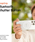 SnapGrip Pro Phone Camera Grip And Magnetic Power Bank With Qi2 Wireless Charging MagSafe Compatible Shutter Button in use