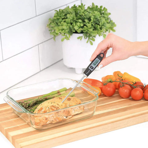 Person using Gourmet Digital Meat Thermometer With Extra Long Probe For Precision Cooking, NSF Certified in grilled chicken dish