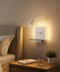 Plug-in & Hardwired LED Wall Sconce, Dimmable Wall Mount Reading Light with USB A & Type C Charging Ports, Flexible Gooseneck, Storage Shelf & Ambient Backlight, Matte White for Bedroom Bedside Hotel, bedside view with light and shelf.