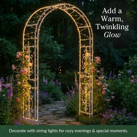 Arch Metal Outdoor Garden Arbor Montebello White 7 Feet Tall Iron Trellis Lattice lit with string lights in a garden
