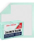Extra Large Disposable Underpads 36 X 36 Inches Pack Of 50 Ultra Heavy Absorbent in mint green color stacked with hexagonal pattern.