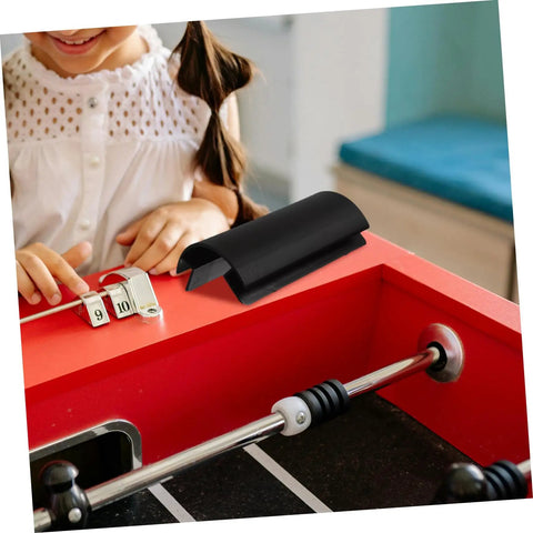 Child playing foosball with Four Pack Soccer Table Corner Protectors And Edge Guards For Foosball Tables Easy Install Plastic Corner Shields.