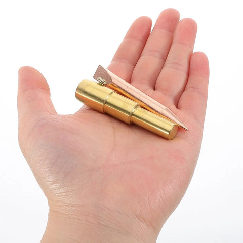 Hand holding golden metal chuck of Spot Weld Dent Puller Kit With Metal Chuck For Car And Sheet Metal Repair High Efficiency Auto Body Tool For Precise Dent Removal And Rugged Pro Grade Auto Body Restoration