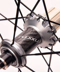 Close-up of carbon fiber tube hub on 700C Road Wheelset With 40mm Rim Profile Reflective Aluminum Alloy Rim Carbon Fiber Tube Hubs