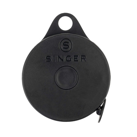 Front view of black circular retractable tape measure case without markings