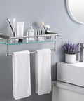 Bathroom Glass Shelf With Towel Bar And Rail 19.6 X 5.9 Inches Heavy Duty Rustproof SUS304 Stainless Steel Brushed Finish Wall Mount Shelf 8mm Tempered Glass Easy Install Rack For Towels And Essentials, mounted above a sink with towels and toiletries.