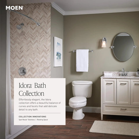 Idora Bath Collection bathroom with shower, toilet, vanity, and mirror showcasing modern design and fixtures by Moen.
