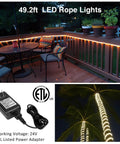 Smart Outdoor Rope Light 49.2ft RGB LED Strip With Music Sync, App Control And RF Remote on a garden patio railing at night.