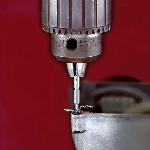 Grabit Micro 4 Piece Bolt And Screw Extractor Kit for tiny stripped fasteners in use on metal surface with drill
