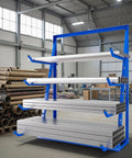 Heavy Duty Lumber Storage Rack With Adjustable Height And Anti Rust Coating Built Like A Tank Rock Solid Four Tier Pipe Rack. Large blue steel rack displaying lumber storage in a workshop.