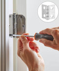 Person installing Miniature Decorative Box Hinges Set 100 Pcs Silver 8x10mm With Nails on white wooden cabinet using a screwdriver.