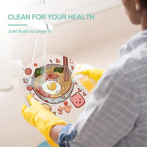 Person rinsing colorful tempered glass cutting board counter protector under running water for easy clean up