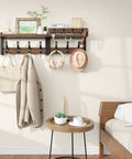 29 Inch Wall Mounted Coat Rack with Swanky Shelf and Heavy Duty Hooks for Entryway Organization, displaying coats and accessories.
