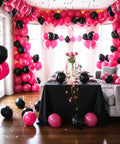 Room decorated with Hot Pink Balloons 154pc Set In 18, 12, 10, And 5 Inch Latex For A Lit Balloon Arch Kit And Garland for a party.