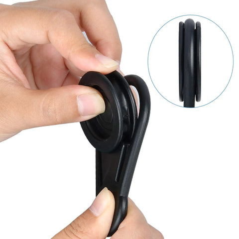 Close-up of hand holding 20 Pack Movable Tarp Clips for Outdoor Camping and Tent Setups, Waterproof Plastic Tarpaulin Clips