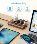 Slick Wood Finish Surge Protector Power Strip With Six Widely Spaced Outlets And Dual USB C Plus Dual USB A Ports on a desk.