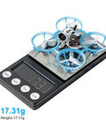 ELRS V3 Air65 Brushless Whoop Quadcopter Ultralight 1S 65mm Tiny Micro Drone with C03 FPV Camera on scale, weighing 17.31g