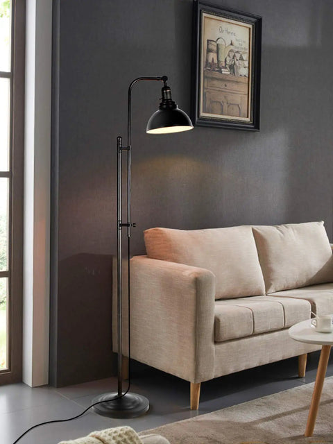 Industrial Floor Lamp For Living Rooms And Bedrooms, Rustic Farmhouse Standing Reading Lamp With Adjustable Metal Heads beside a beige sofa.