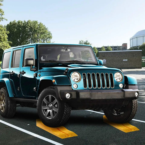 An SUV parked on 4 Pack Leveling Ramps For Cars And SUVs Anti Slip Wheel Chocks And Levelers For Camper Trailer On Uneven Ground Heavy Duty Stabilizers To Lift And Stabilize Your Ride.