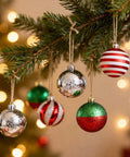 Christmas tree branch with colorful ornaments hanging on 328 Ft Jute Twine 1.5 mm 2 Ply Natural Craft Twine String For Gift Wrapping DIY Crafts Gardening And Home Use On A Paper Spool Totally Handy For Packaging Projects Embellishing Gifts And Everyday Tying Tasks twine.