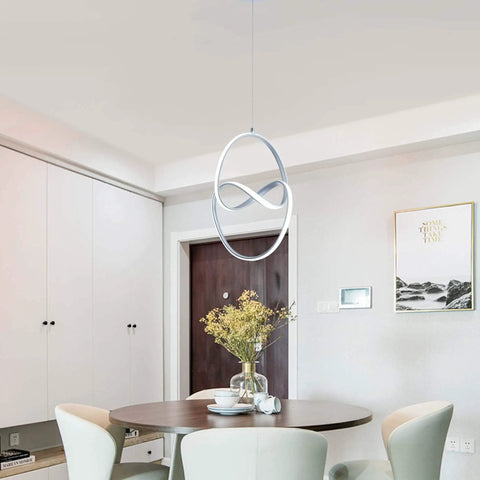 Lit Modern LED Pendant Light With Irregular Ring Design hanging above dining table, 6000K Cool White, 33W, 1980lm, silver finish
