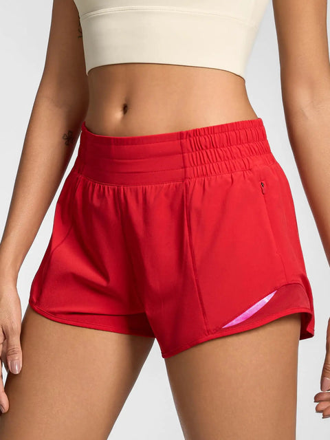 Model wearing Womens Quick Dry Running Shorts 2.5 Inch Inseam With High Waisted Zip Pockets Lightweight Gym Shorts Built In Liner XS